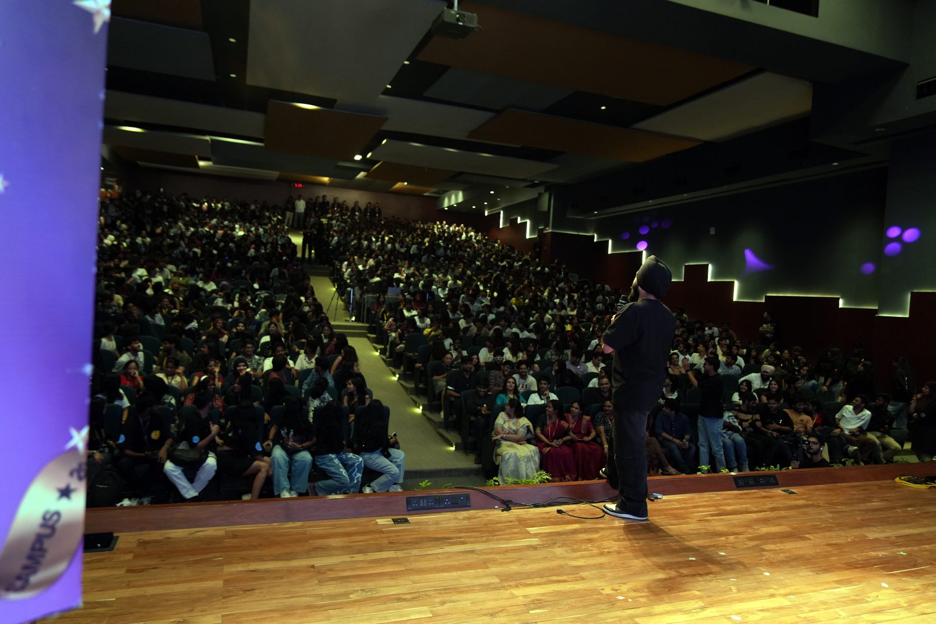 A packed tiered auditorium